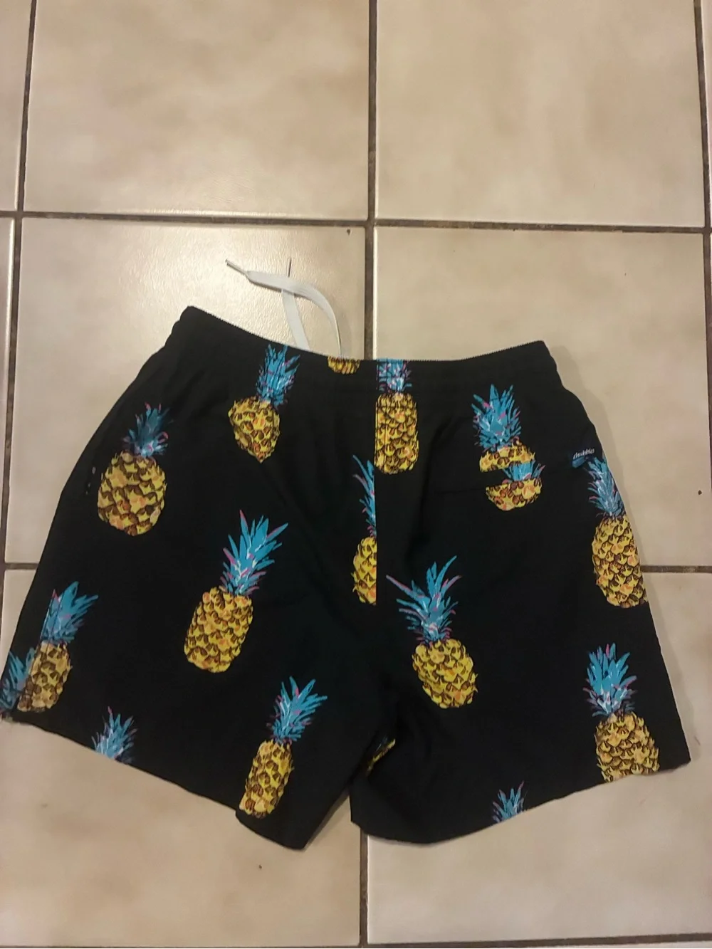 chubbies Black Swim Trunks with Yellow Pineapple and Blue-Teal Tops